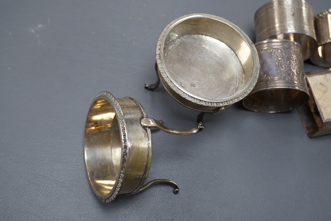 A pair of 19th century tripod salts, height 60mm, together with eight assorted silver napkin rings and a pair of small Victorian silver coasters?, 16.5oz.
